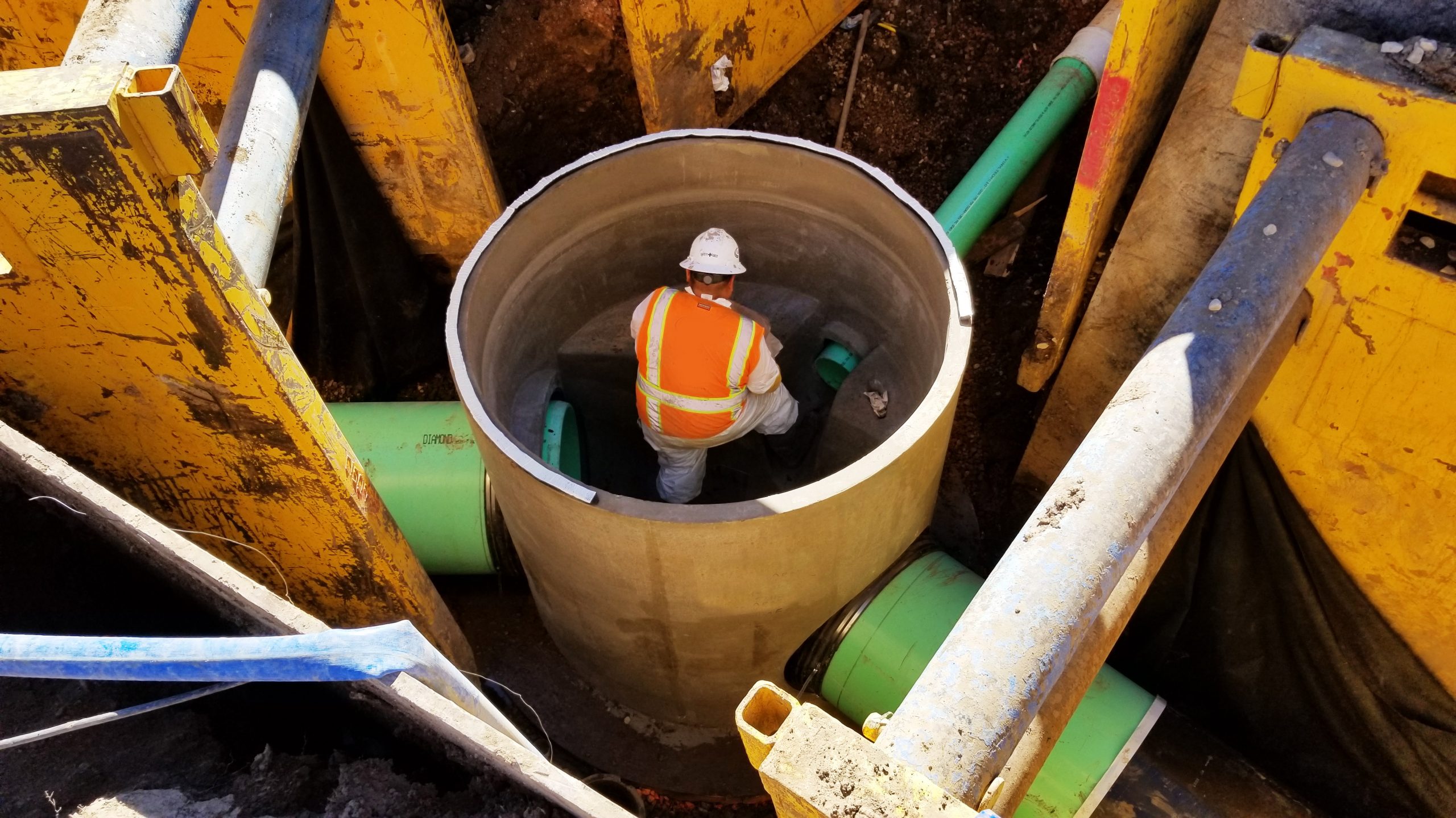 Construction worker on site working on Silver Creek Trunkline Sewer Rehabilitation.